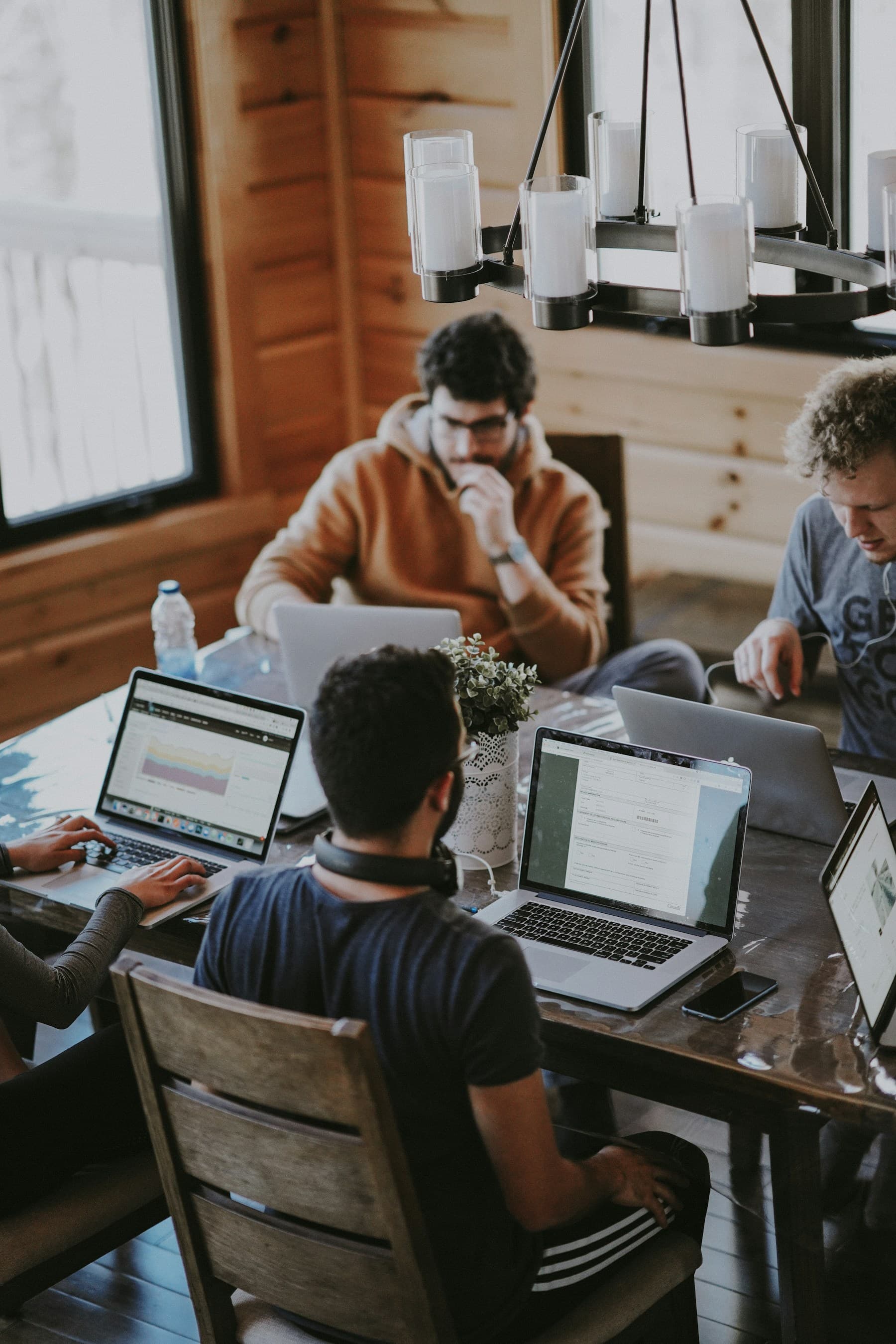 A diverse technology team collaborating around a table